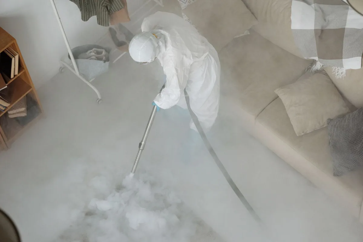 Biohazard cleanup technician in protective equipment, North Randall, OH